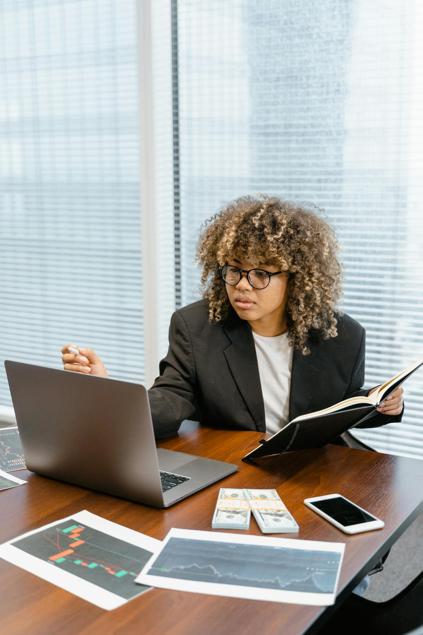 Consultant reviewing business data and website performance on a laptop